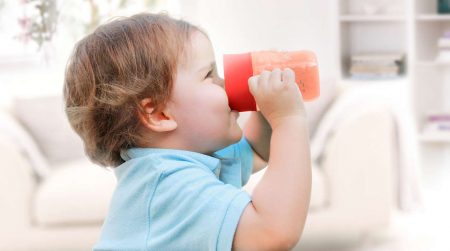 Baby drinking from sippy cup